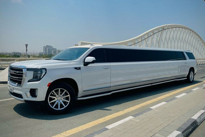 Experience the glamour of Dubai in a luxurious limousine cruising past iconic landmarks while enjoying a stylish interior perfect for any special occasion or unforgettable adventure.